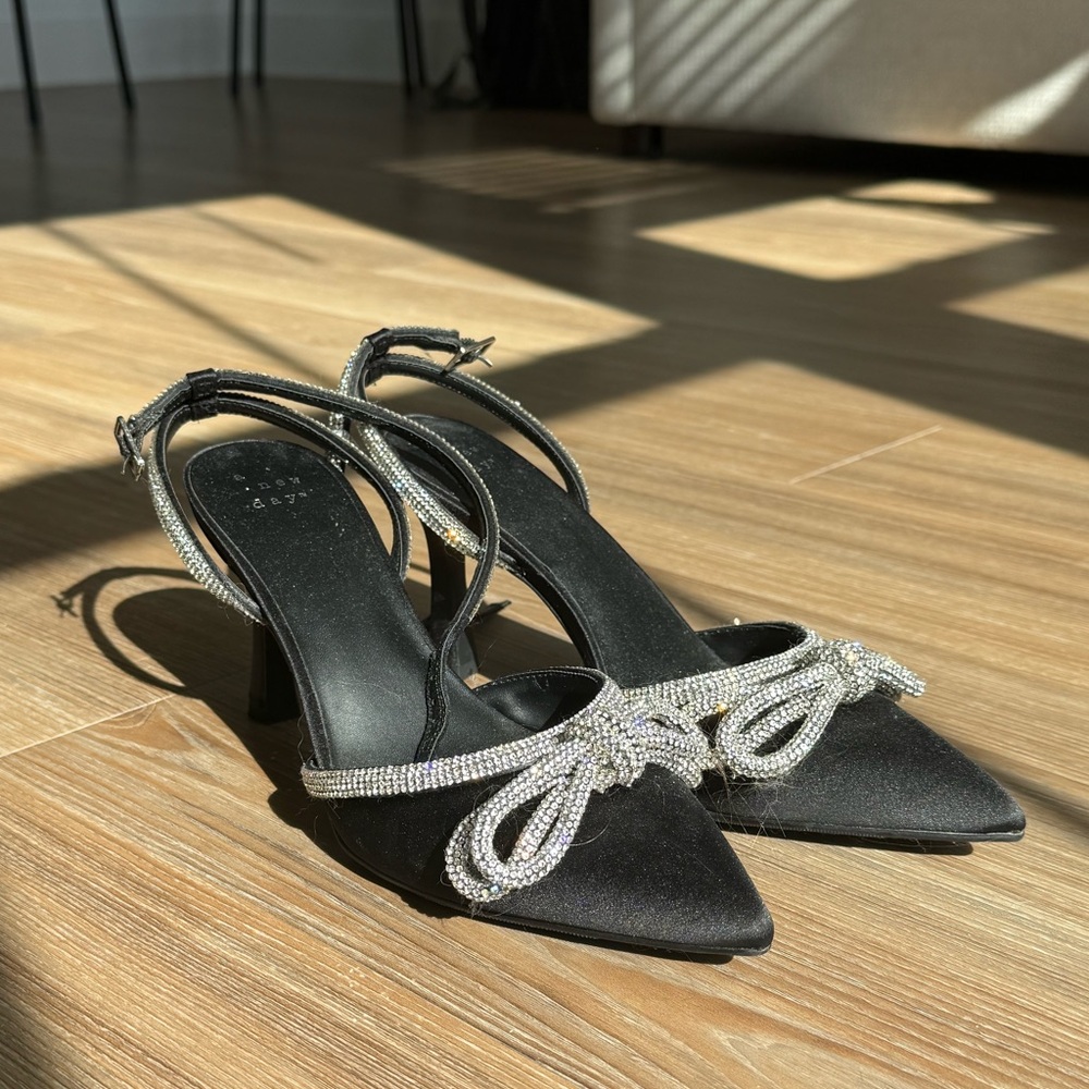 Black satin heel with silver bow details